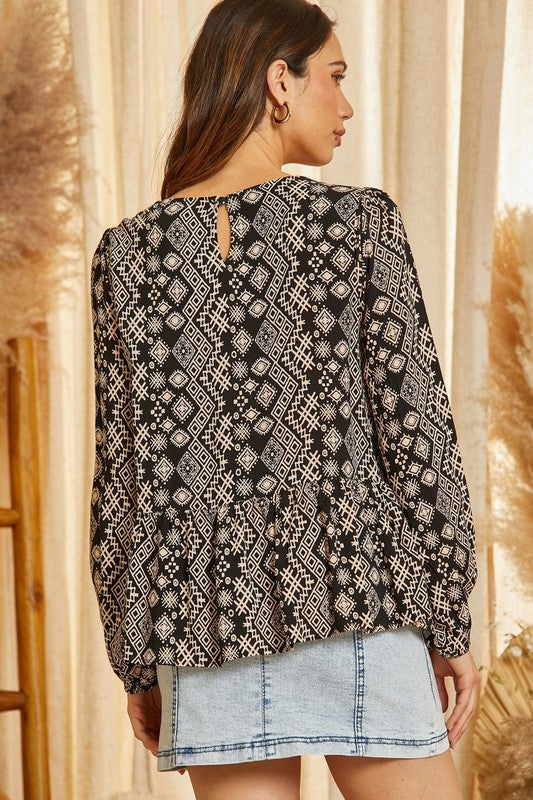 Womens Andre Printed aztec top with bright and bold embroidery that's perfect with the print! This top features round neckline, balloon sleeves, ruffle hemline. Woven, non sheer.