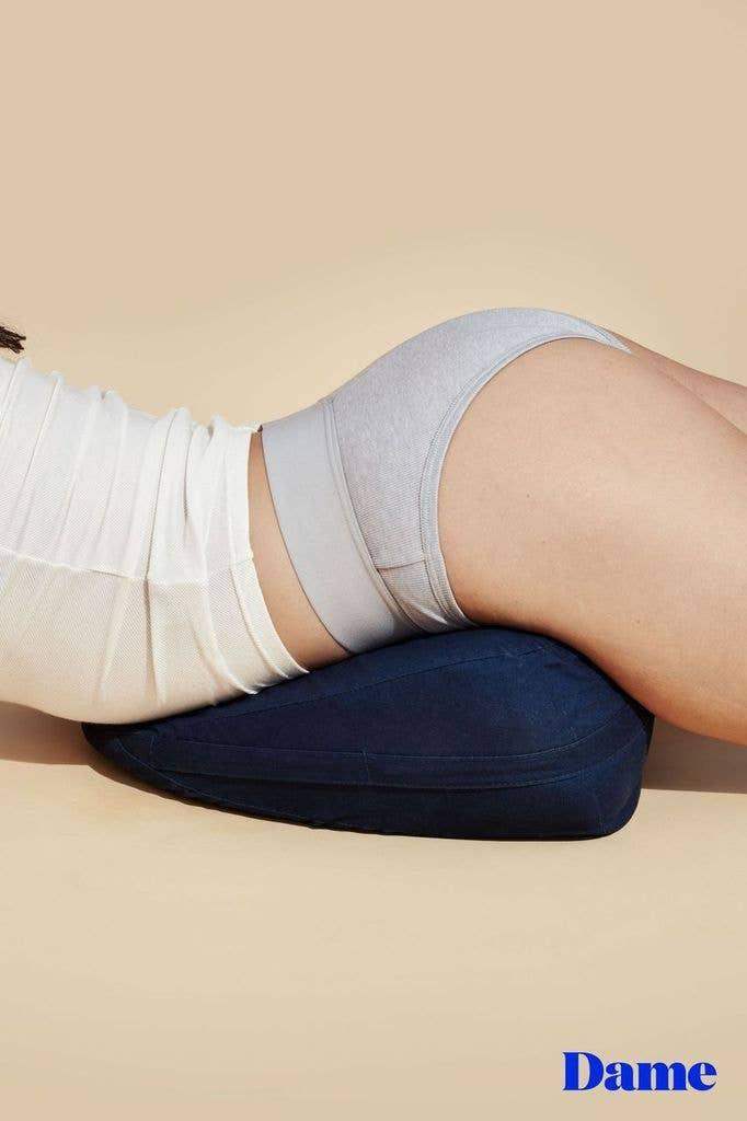 photo of best sex wedge pillow woman resting on wedge with her butt in the air