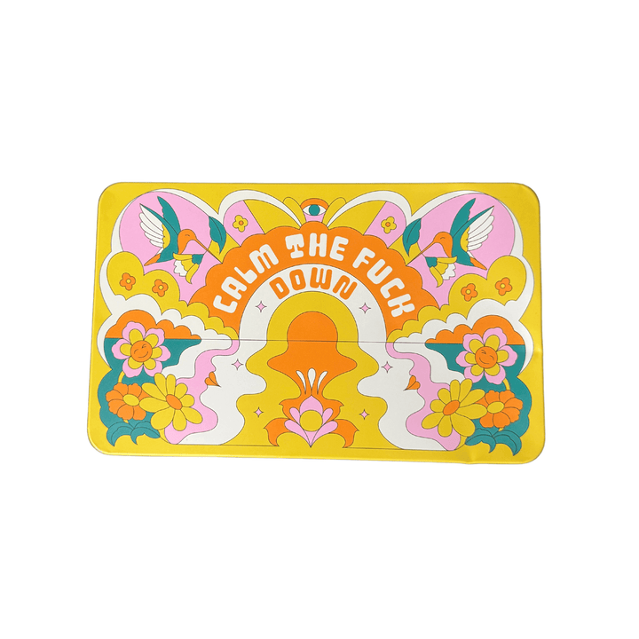 tin box of bath bombs that says calm the f down