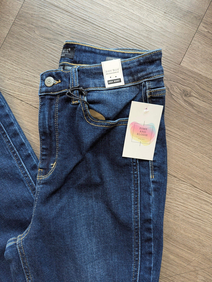 judy blue flare leg jeans close up waist band in a dark wash
