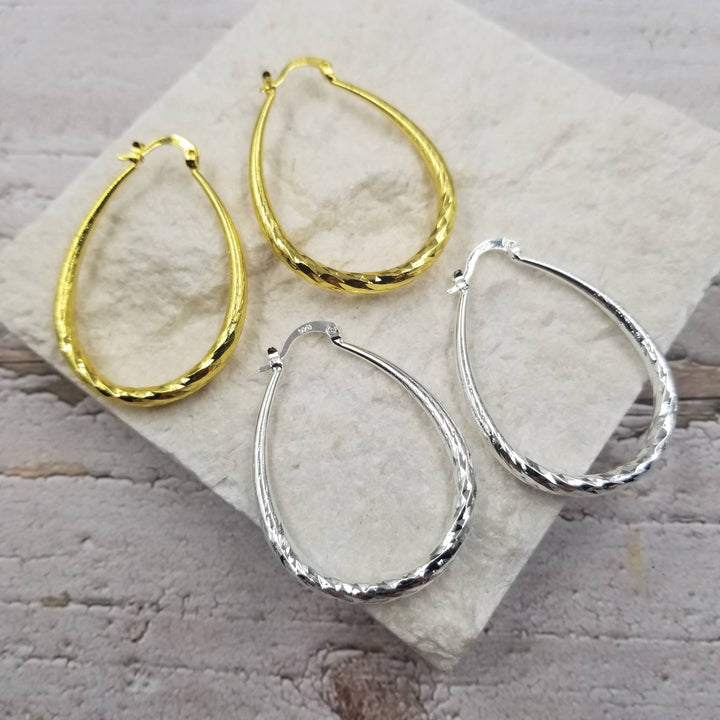 Treasure Wholesale - Textured Yellow Gold & Silver Oval Hoop Earrings: Silver
