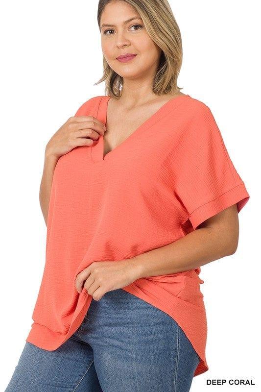 Plus Women's Woven Airflow top with hi-low hem in Coral Crush - Esme and Elodie